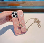 Pink soft canvas crossbody iPhone case close-up showing the fabric texture and strap detail