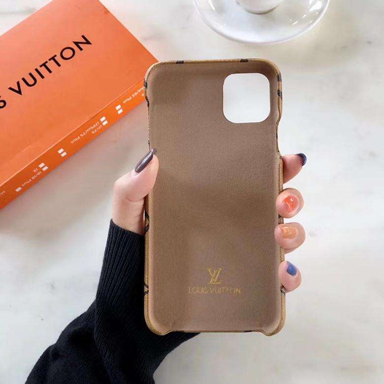 Close-up of the classic leather iPhone case showing the patterned surface and camera area