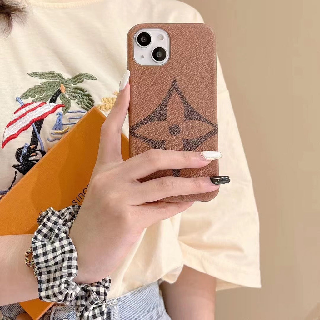Brown monogram iPhone case showing the slim profile, camera cutout and edge finish