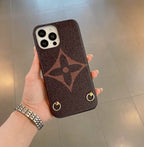 LV design crossbody iPhone case close-up showing material texture and strap attachment