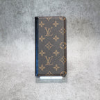 LV leather iPhone wallet case showing the patterned exterior and fitted camera area