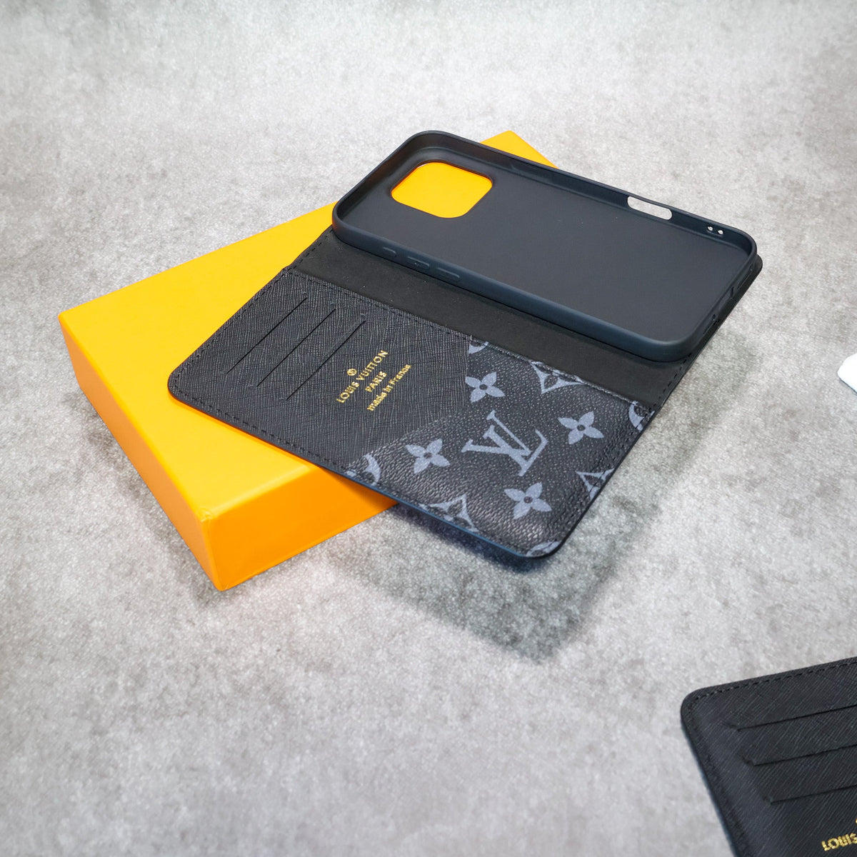 Leather iPhone wallet case showing the folding design, card storage and camera opening