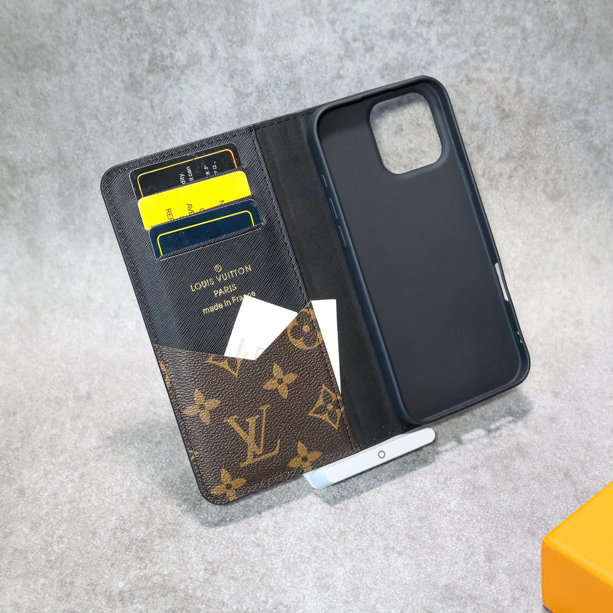 LV iPhone wallet case showing the protective folio cover and fitted phone shell