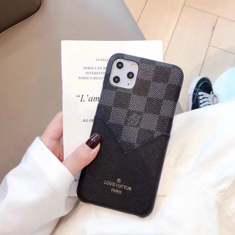 Black checkered Louis Vuitton iPhone case showing the patterned protective rear cover