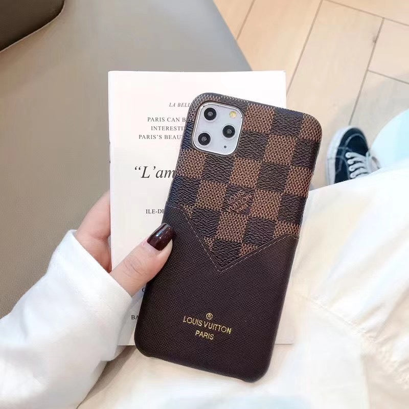 Brown checkered Louis Vuitton iPhone case showing the accent-patched leather finish