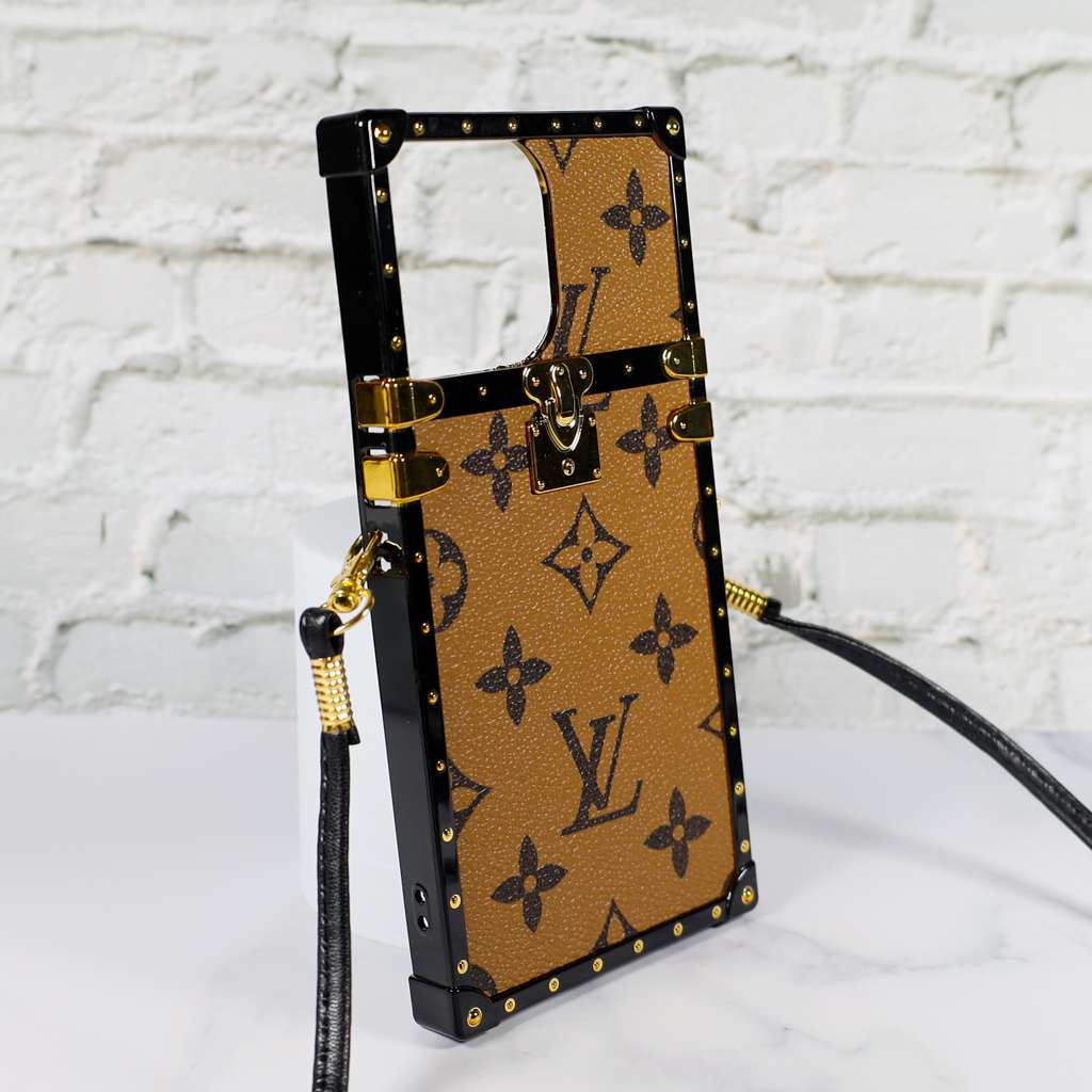 Designer trunk iPhone case showing the structured rear cover and reinforced protective edges