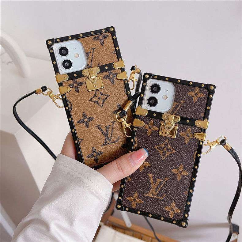 LV trunk iPhone case showing the reinforced trunk-style back and decorative hardware