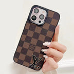 Detailed back view of the LV monogram luxury iPhone case showing pattern and protective fit