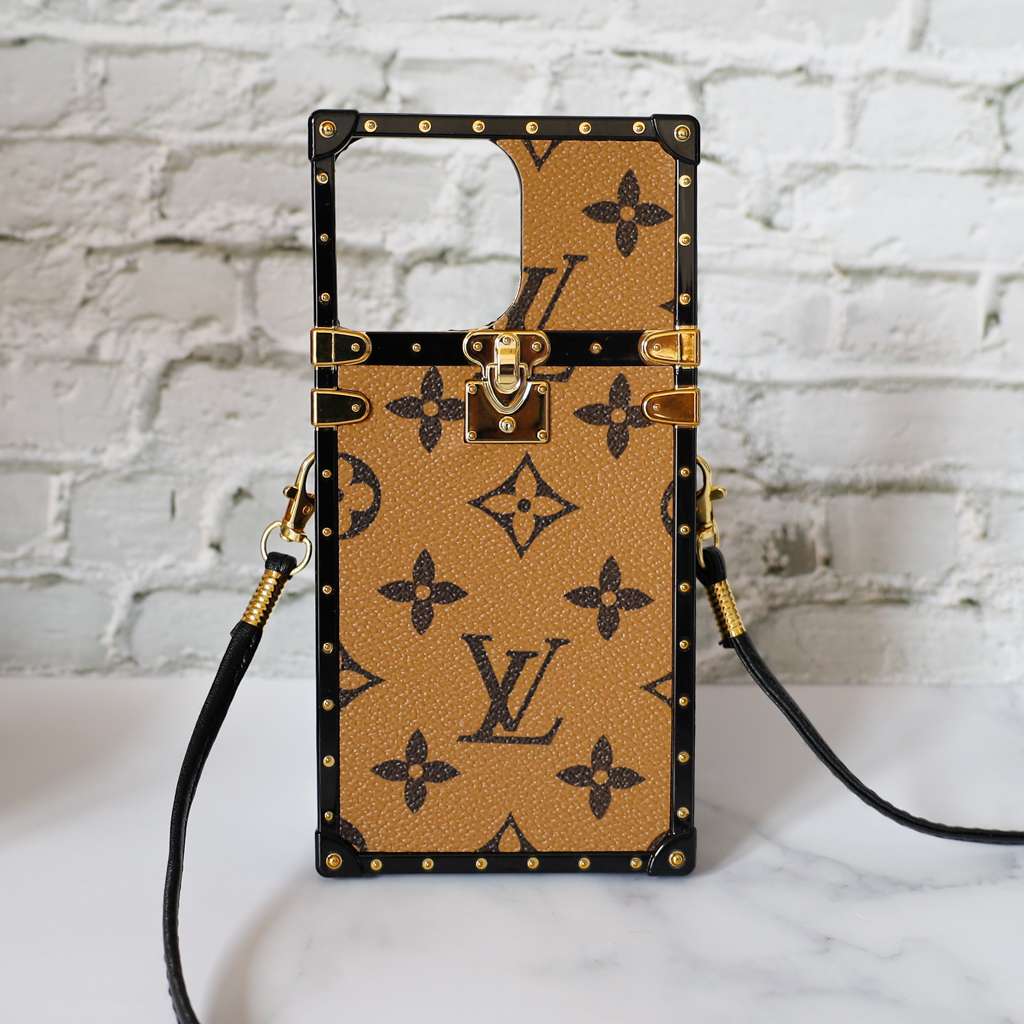 Latte LV trunk iPhone case showing the light patterned back and structured protective frame